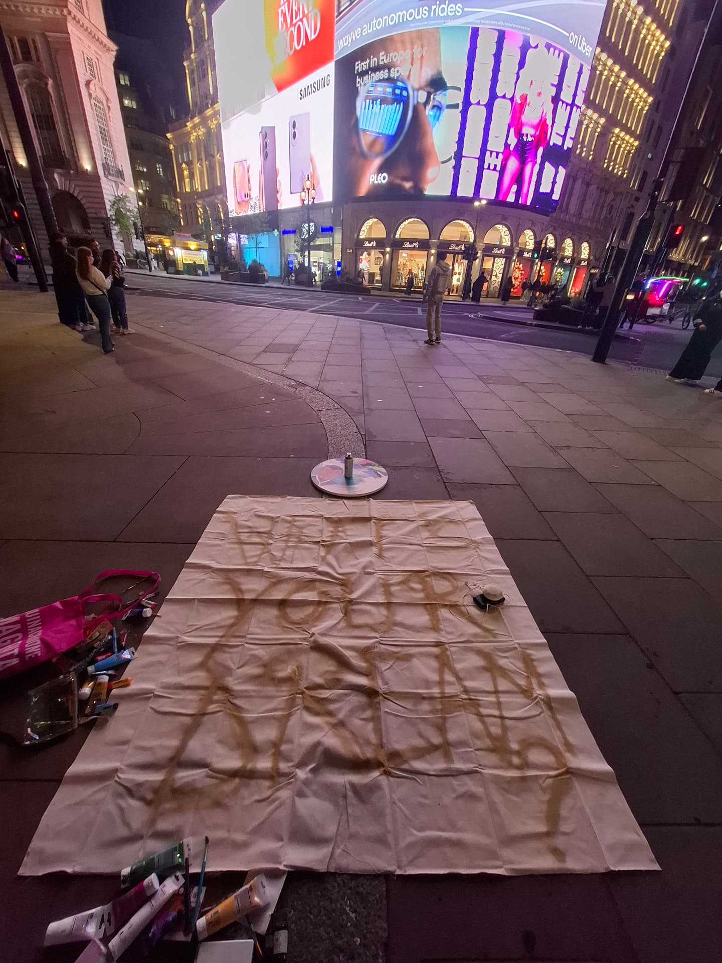 A canvas laid out at Piccadilly Circus at night