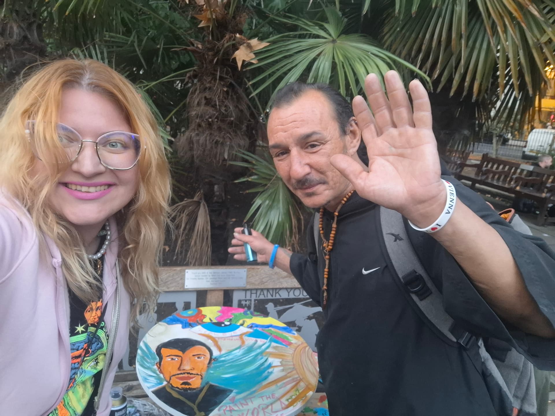 Waving together next to the finished painting